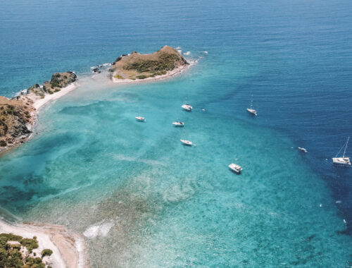 BVI sailing adventures sailboat anchored in turquoise waters at Long Bay Jost Van Dyke British Virgin Islands